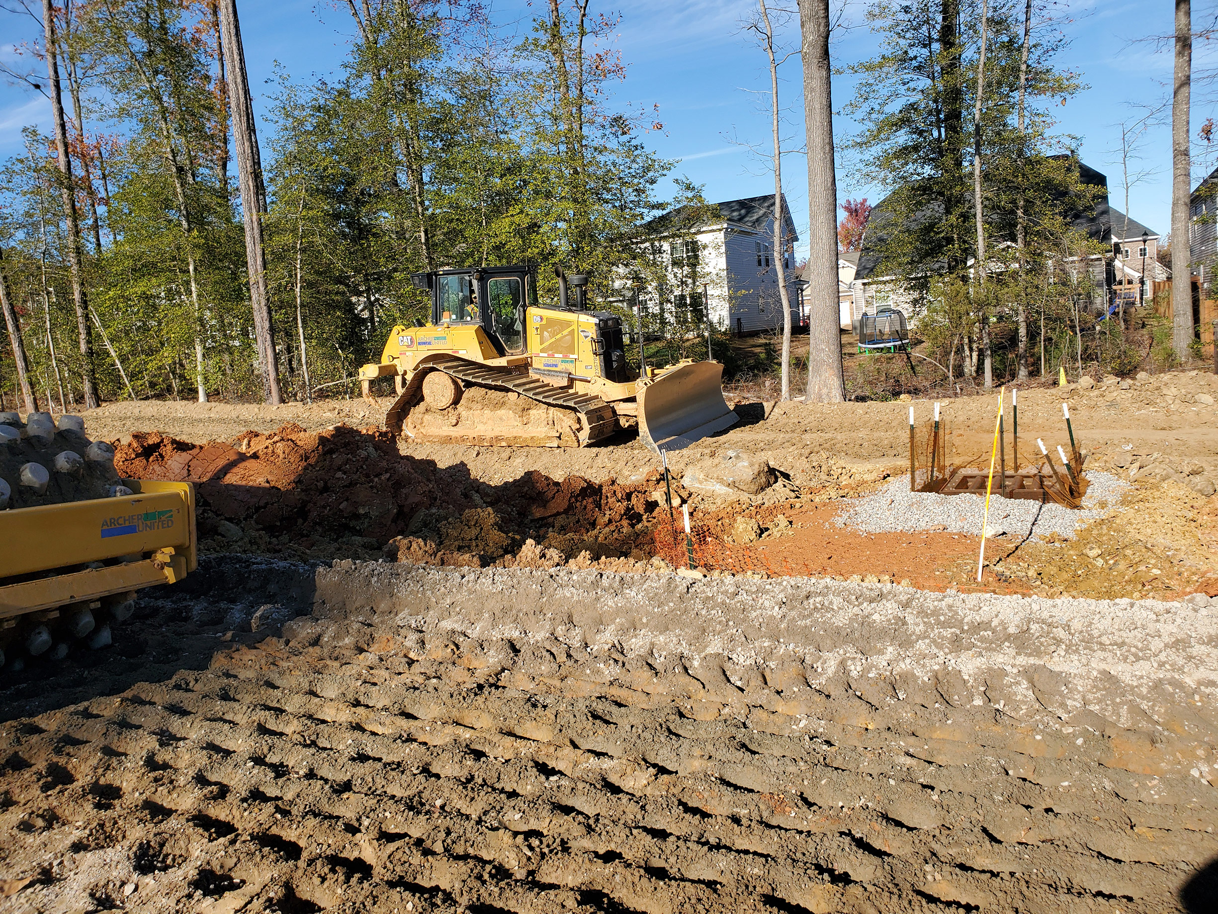 This photo shows the earthwork crews grading and compacting the soils in Segment 2.  When earthwork is completed in this area, the sound barrier wall can be erected to reduce the highway noise.