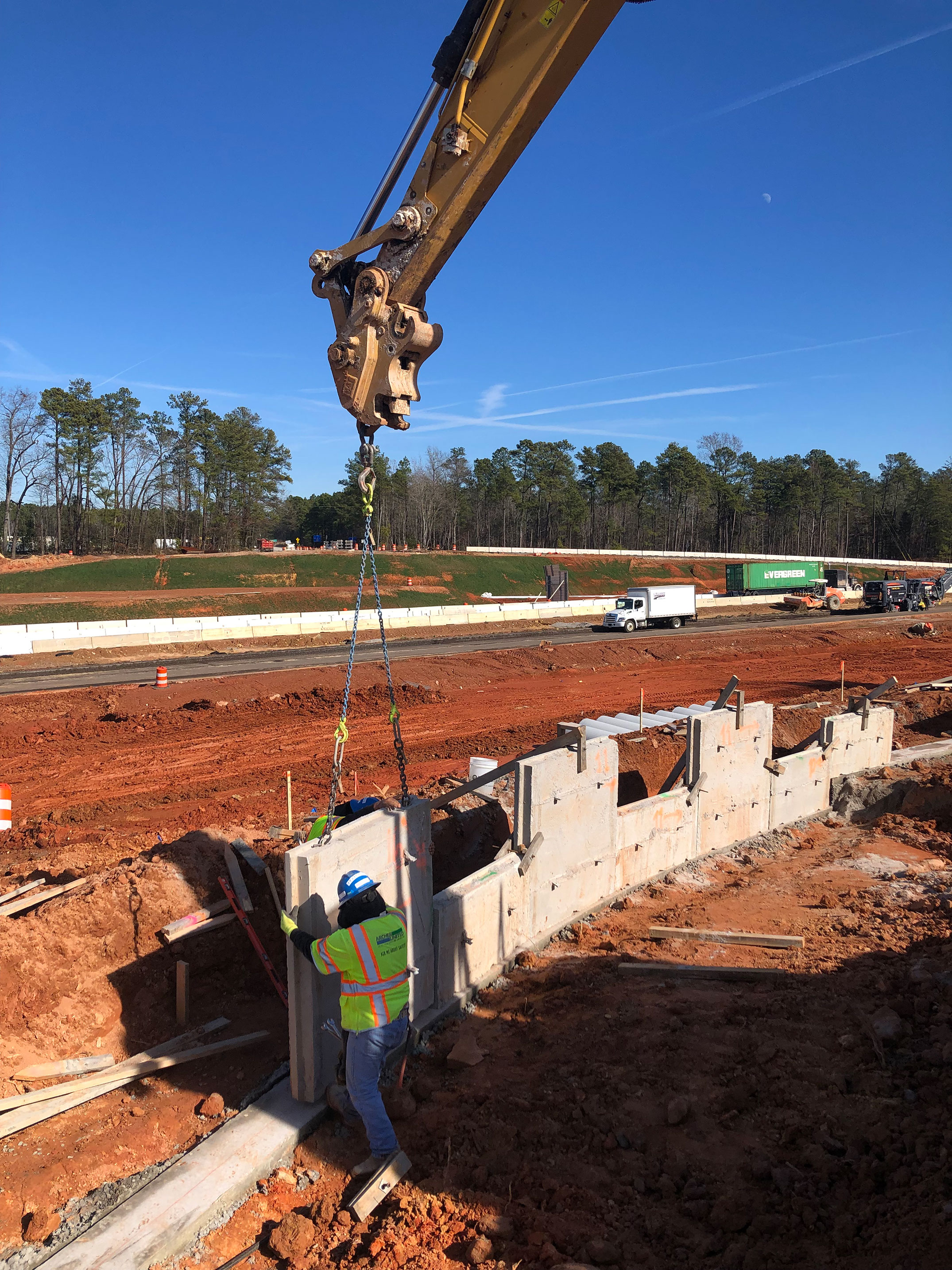 Retaining wall panels are being placed for the construction of the new roundabout at the intersection of Crooked Creek Road and Columbia Ave.  Studies have shown that roundabouts are safer than traditional stop sign or traffic signal controlled intersections.
