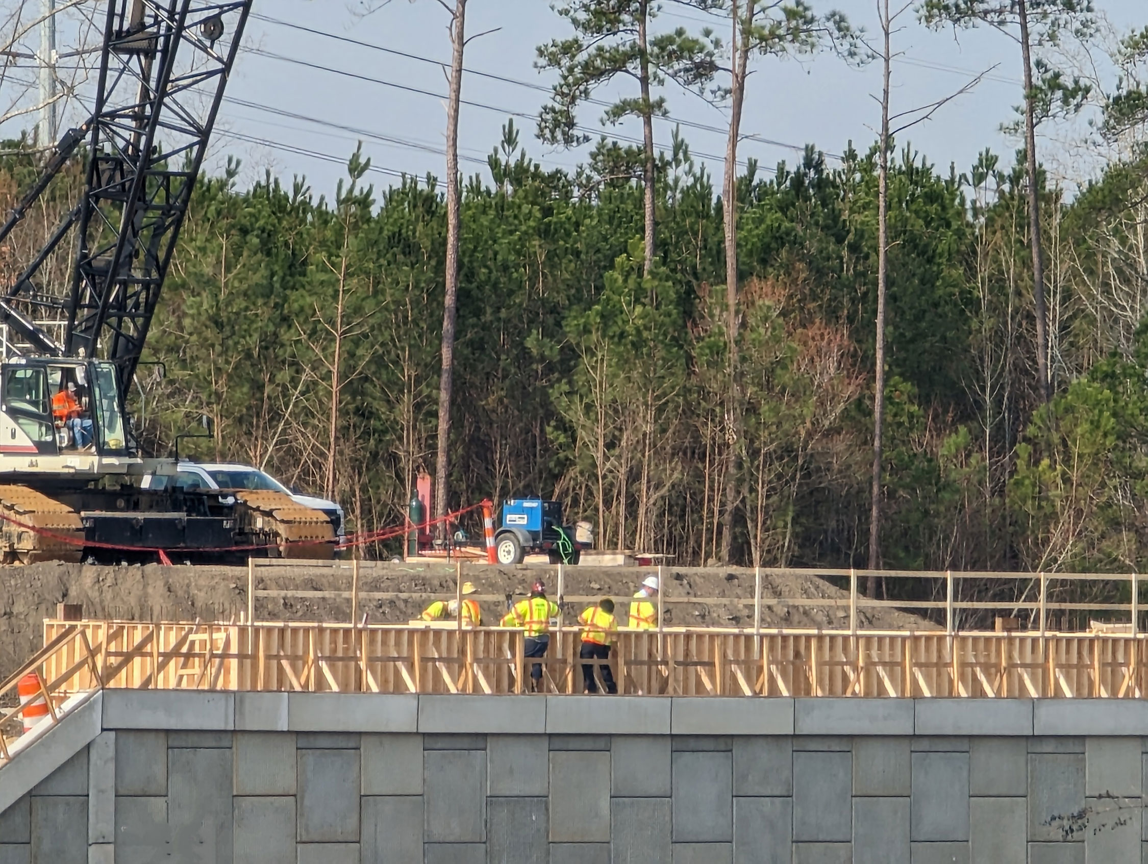 The new bridge over I-26 at Columbia Avenue is under construction.  Here crews are forming up the end bent cap on the Eastbound side of the interstate.